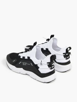 Czarno-białe sneakersy z odblaskowymi detalami