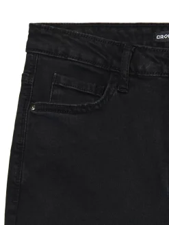 Jeansy skinny z surowym wykończeniem