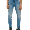 Niebieskie jeansy skinny z przetarciami