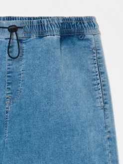 Niebieskie jeansy typu parachute