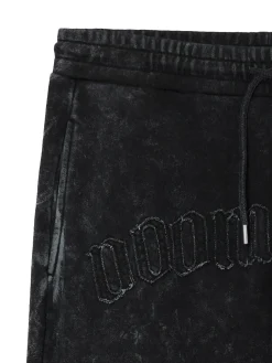 Spodnie joggery regular z napisem